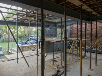 View of scaffolding on the ground floor of a housing project.