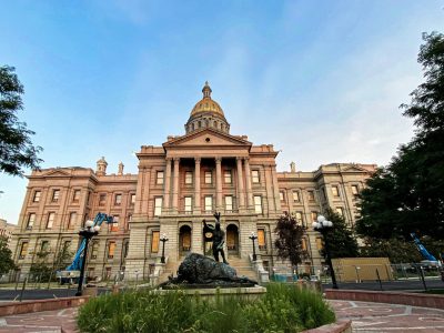 The exterior of the Colorado state capitol on a clear day.